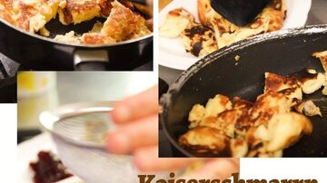 Ein köstlicher Kaiserschmarrn wird serviert, perfekt zubereitet in einer Pfanne. Die Speise wird mit Puderzucker und Kompott angerichtet.