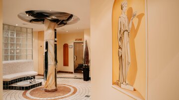 Ein eleganter Innenraum mit einer Säule und stilvollen Verzierungen. An der Wand ist eine Statue abgebildet, die eine kunstvolle Atmosphäre schafft.